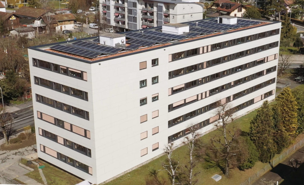 Rénovation énergétique, écologique et innovante d'un bâtiment de 36 appartements par des éléments modulaires en bois